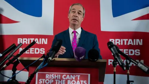 Nigel Farage speaking at a Reform UK press conference in Dover