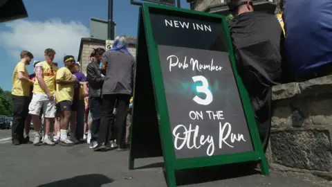 A chalkboard sign which says 'Pub Number 3 on the Otley Run'