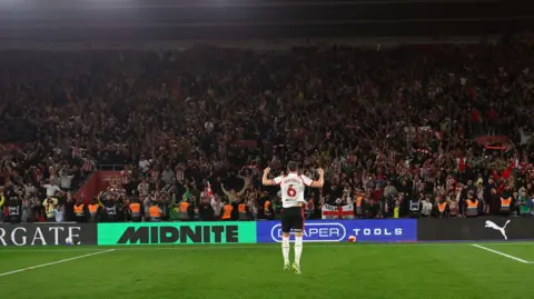 Getty Images Taylor Harwood-Bellis of Southampton celebrates in front of fans during the Sky Bet Championship Play Off Semi Final Second Leg match between Southampton and Middlesbrough at St Mary's Stadium on May 12, 2026 in Southampton.