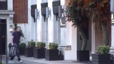 Met Police Stewart Ahearne was pictured by officers as he entered the five-star Marriott Hotel on Grosvenor Square during a sting operation to retrieve a stolen vase