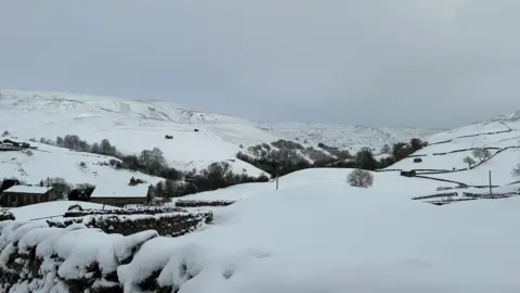 Claire Calvert A very snowy image of the Yorkshire Dales with a grey sky above.