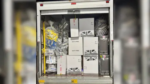 Medway Council The image shows boxes of tobacco in the back of a white van.