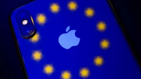 Getty Images An iPhone with the EU logo projected onto it