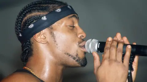 Getty Images D'Angelo, performing on stage, Axion Beach Rock Festival, Zeebrugge, Belgium, 15 July 2000