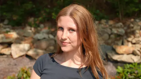 Elvie, a teenage girl with red hair