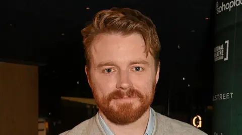 Getty Images Actor Jack Lowden with a red beard