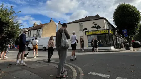 People were seen looking up at the new work on Friday morning