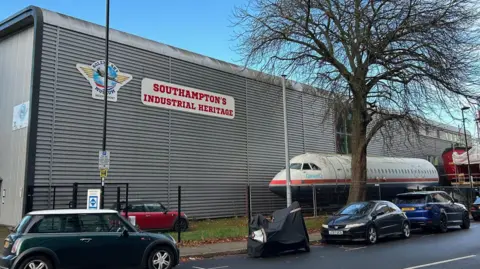 LDRS Solent Sky Museum in Albert Road South, Southampton. It is building made from corrugated metal. At the front of a building is the body of an aeroplane with no wings. 