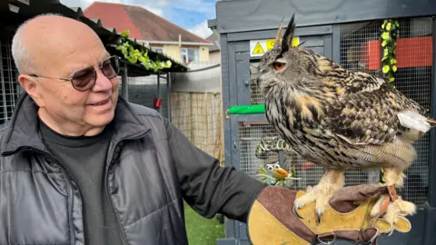 BBC Geoff Grewcock holding one of the resident owls
