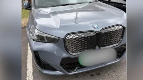 The image that Ashley Tomlin posted on the Facebook group. The number plate of the car is blurred out.