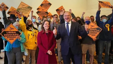 PA Media Sir Ed Davey and Lib Dem activists