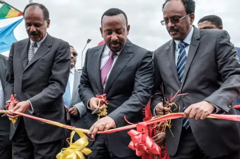 AFP L-R: Eritrea's President Isaias Afwerki, Ethiopia's Prime Minister Abiy Ahmed and Somalia's President Mohamed Abdullahi Mohamed cut the ribbon at the Tibebe Ghion Specialised Hospital in Bahir Dar, Ethiopia - Saturday 10 November 2018