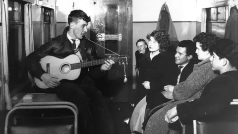 Getty Images Busker in a Tube carriage