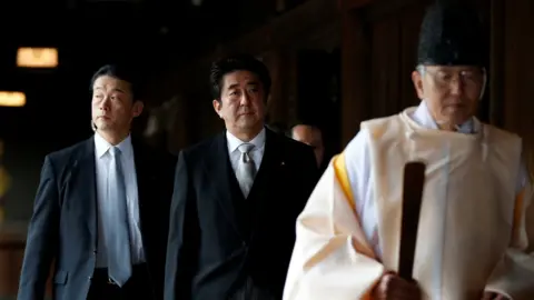 Yasukuni Shrine: Japan's ex-PM Abe visits controversial memorial
