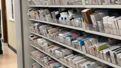 BBC Rows of pharmacy drugs