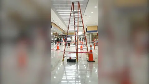 A red ladder in a cordoned off area at Benito Juárez International Airport in Mexico City.