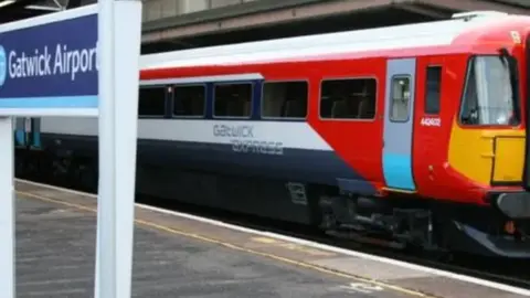 A Gatwick Express train being driven through Gatwick Airport.