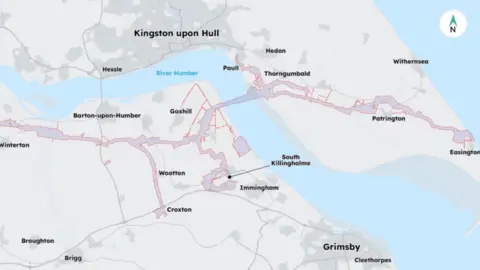 NEP A top-down map showing a stylised view of a river estuary and the sea, in blue, and the land around it, in shades of grey. Towns and villages are labelled in black text. They include Kingston upon Hull and Grimsby. Across the centre of the map, the route of a pipeline is marked out, shaded in purple with red borders. The route snakes from the left of the picture to the right, where it meets the sea.
