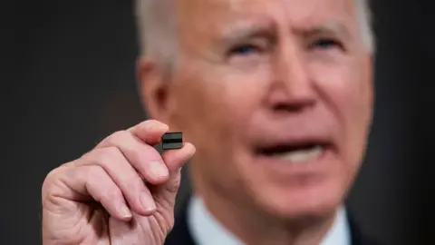 Getty Images President Biden holds chip