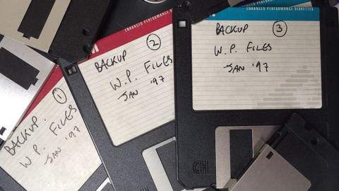 A pile of discarded old floppy discs used for backup