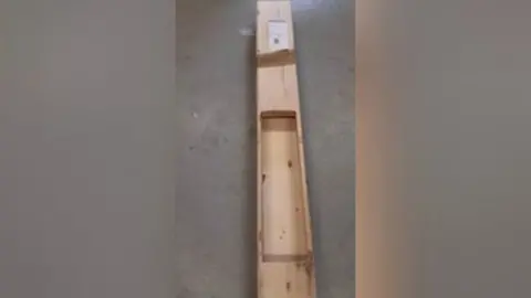 NCA Wood flooring with a hollowed ou centre. it's sitting on the ground.