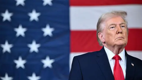 US President Donald Trump looks on during an event with members of the military and their families at Fort Bragg, North Carolina on February 13, 2026. Trump will meet on Friday with the special forces soldiers who captured Venezuelan leader Nicolas Maduro in a deadly raid in Caracas in January. (Photo by Mandel NGAN / AFP via Getty Images)