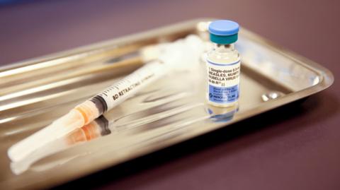 Measles vaccine and syringe 