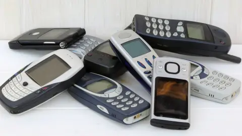 Getty Images Pile of old phones