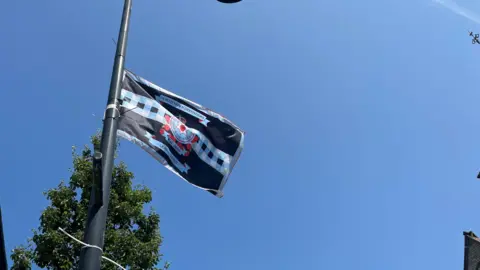 A flag erected on a lamp-post on High Street in Holywood, County Down
