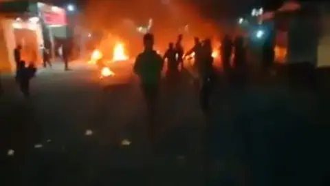 Facebook Screen grab from Facebook video shows fire in the streets of Gaza Strip