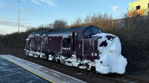 Network Rail A train snowplough, covered with snow at the front