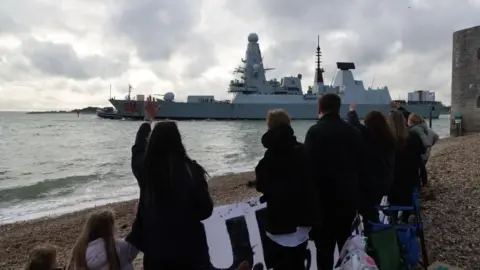 Royal Navy/PA Media Crowds gather as HMS Dragon leaves Portsmouth Harbour on its way to the Eastern Mediterranean 