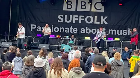 Connor Bennett/BBC Afterdrive on the BBC Suffolk stage at Ipswich Music Day. The four members of the band are in full flow.