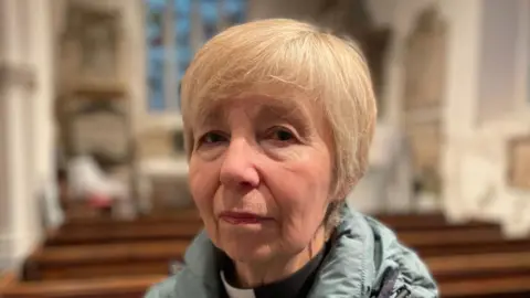 A photo of Canon Sue Field looking directly at the camera