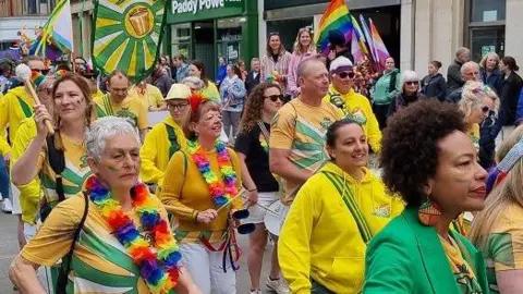 Cheltenham Pride Colourful parade walking through town