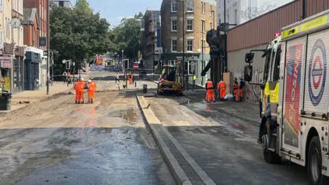 ANGIE GEORGE/BBC The clear-up operation on Pentonville Road on Sunday afternoon