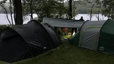 Cumbria Police Campers next to tents next to lakes