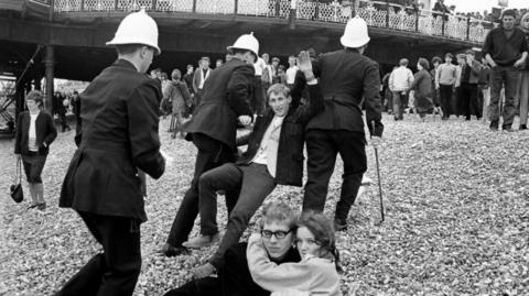 Youth being arrested on Brighton beach in May 1964