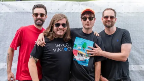 Getty Images Kyle Simmons, Chris Wood, Dan Smith and Will Farquarson of Bastille backstage at Reading Festival last month