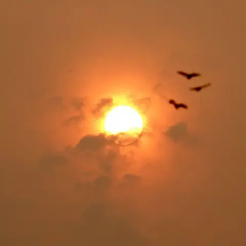 Skies over parts of UK turn 'fiery' red in rare sunset phenomenon