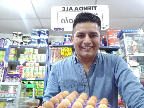 Ed Hernandez Ed Hernandez in his store holding eggs