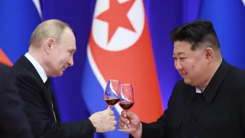   VLADIMIR SMIRNOV/POOL/AFP Russian President Vladimir Putin and North Korean leader Kim Jong Un toast during a reception at the Mongnangwan Reception House in Pyongyang on June 19, 2024.