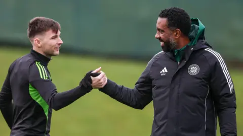 Kieran Tierney shakes hands with Wilfried Nancy