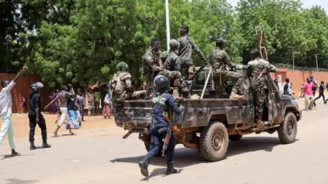 Reuters Security forces on the back of a vehicle in Niger