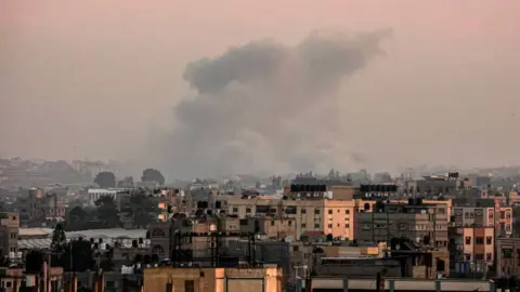 AFP Smoke billows over Khan Yunis following an Israeli strike