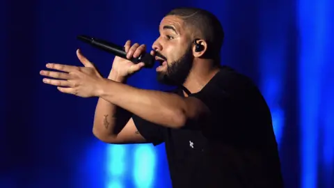 Getty Images Drake performing on stage