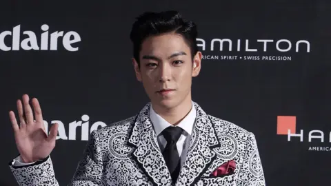 Getty Images T.O.P. of Bigbang arrives for the Marie Claire Asia Star Awards during the 18th Busan International Film Festival on October 5, 2013 in Busan, South Korea.