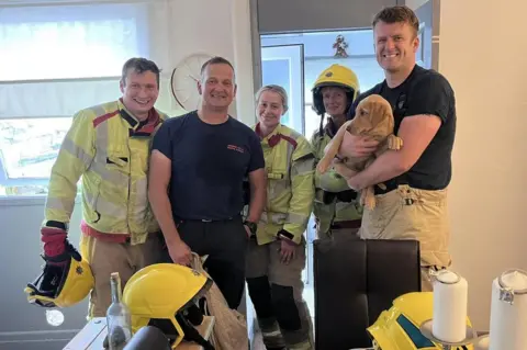 Carlisle East Fire Station Firefighters with the puppy