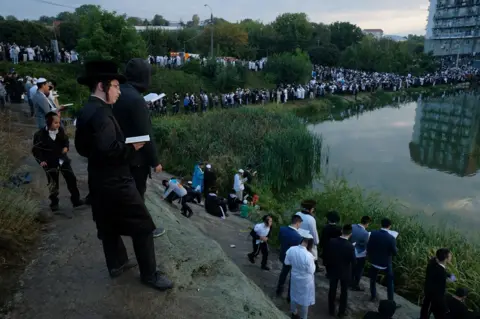 Getty Images Religious Jews perform tashlikh, a Jewish atonement ritual, at a lake formed by the Umanka River on the first day of Rosh Hashanah on September 10, 2018 in Uman, Ukraine
