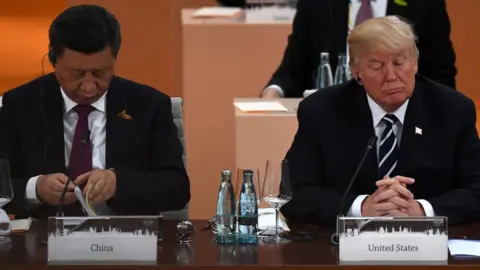 Getty Images China's President Xi Jinping (L) and US President Donald Trump attend a working session on the first day of the G20 summit in Hamburg, northern Germany, on July 7, 2017